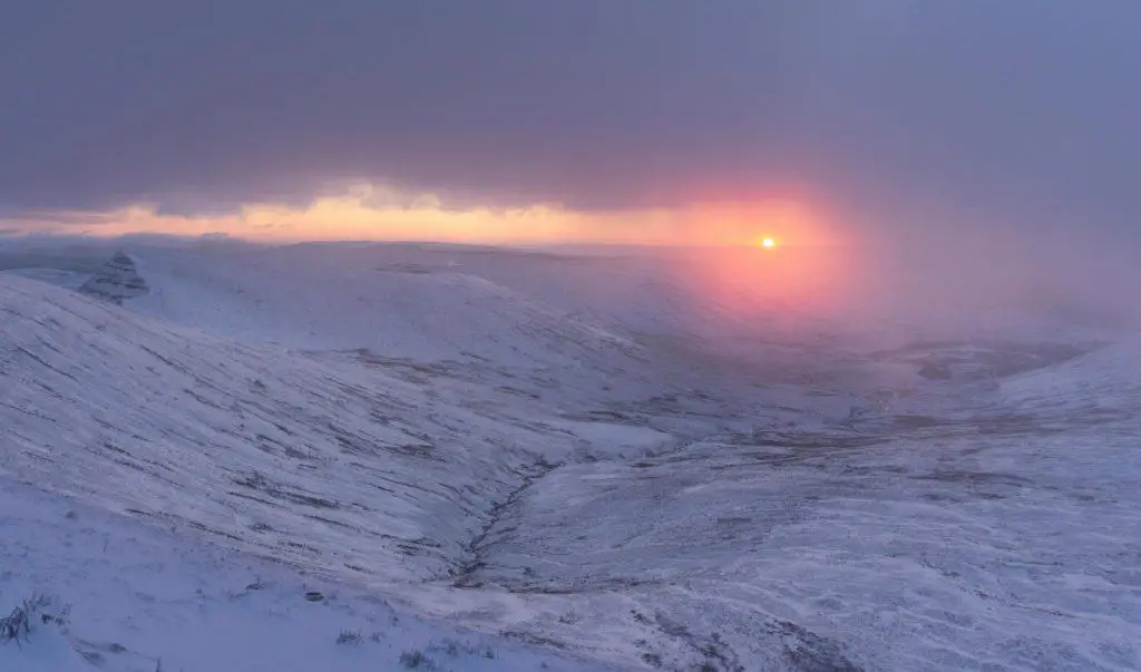 Sunrise snowy iews whilst walking Pen y Fan from Pont ar Daf