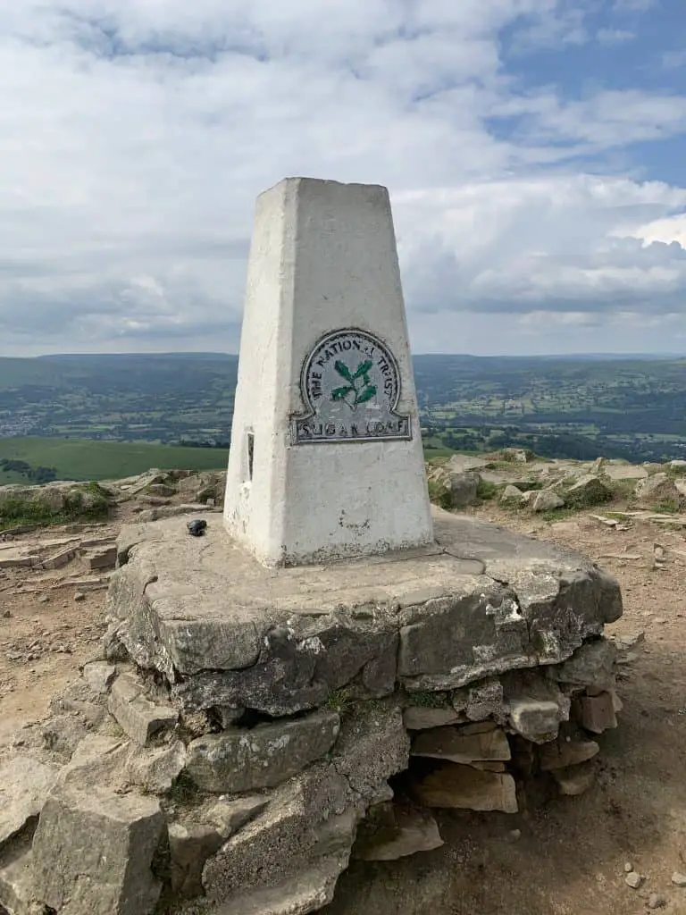 Trig point on the summit of a Sugar Loaf walk