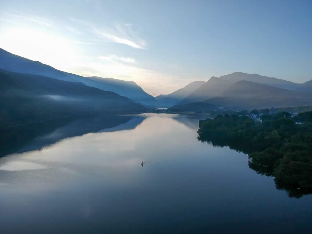 Llyn Padarn at Llanberis. Paddle boarding on the lake is a fun activity in Snowdonia