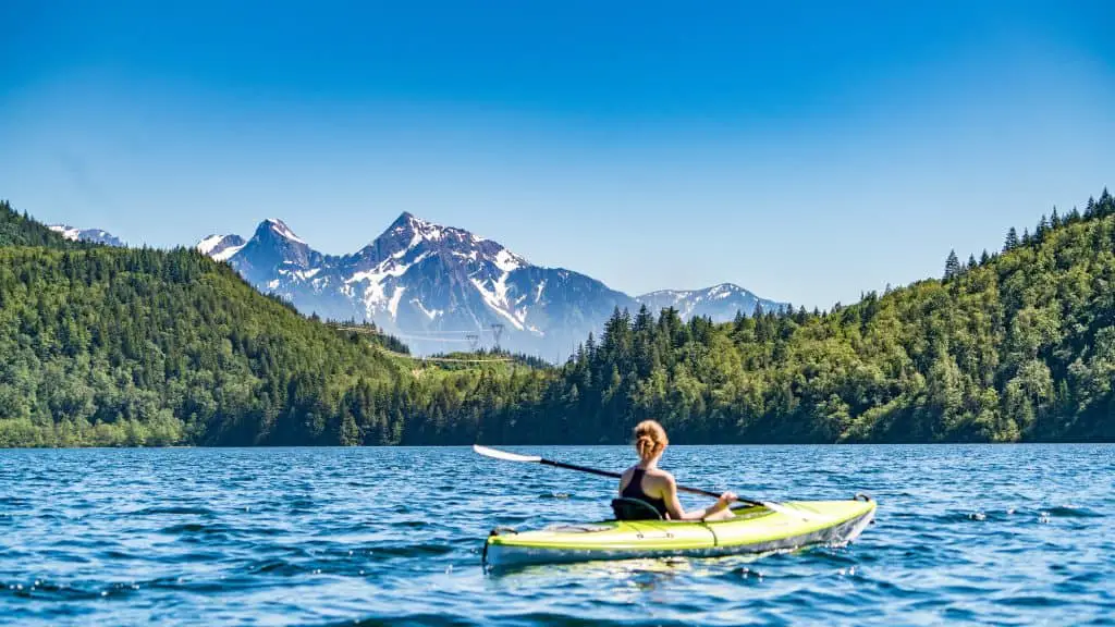 Kayaks allow van lifers to explore beautiful lakes with mountain vitas 
